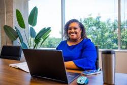 Andrea Durham working at a desk